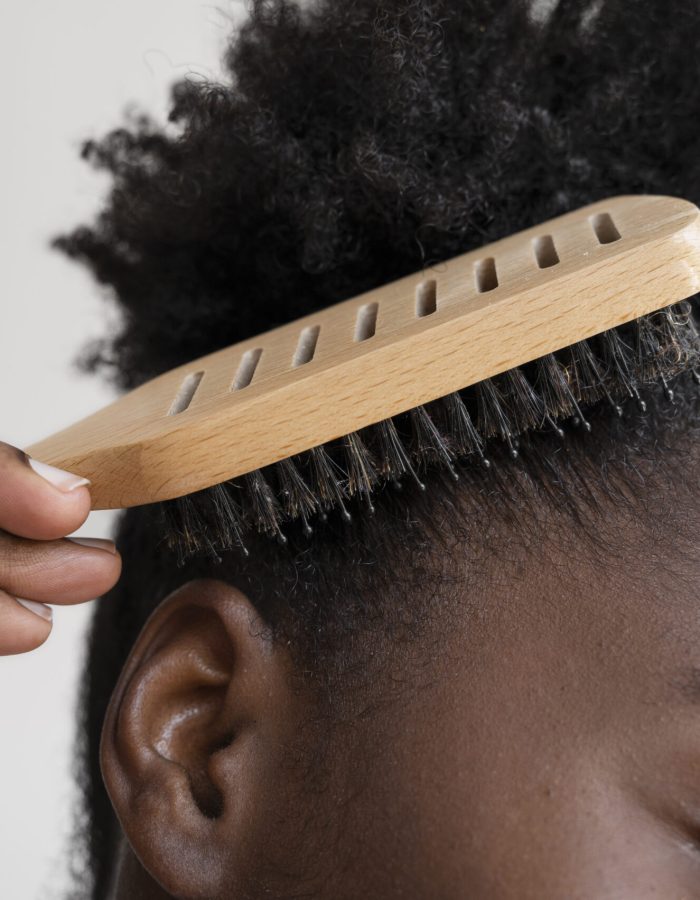 side-view-woman-brushing-hair