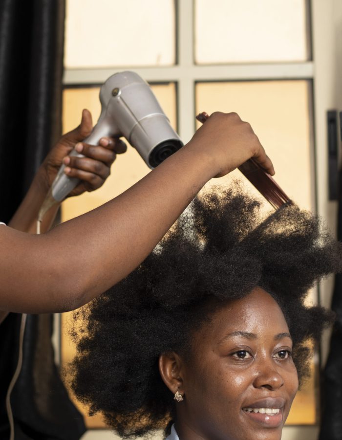 stylist-woman-taking-care-her-client-afro-hair